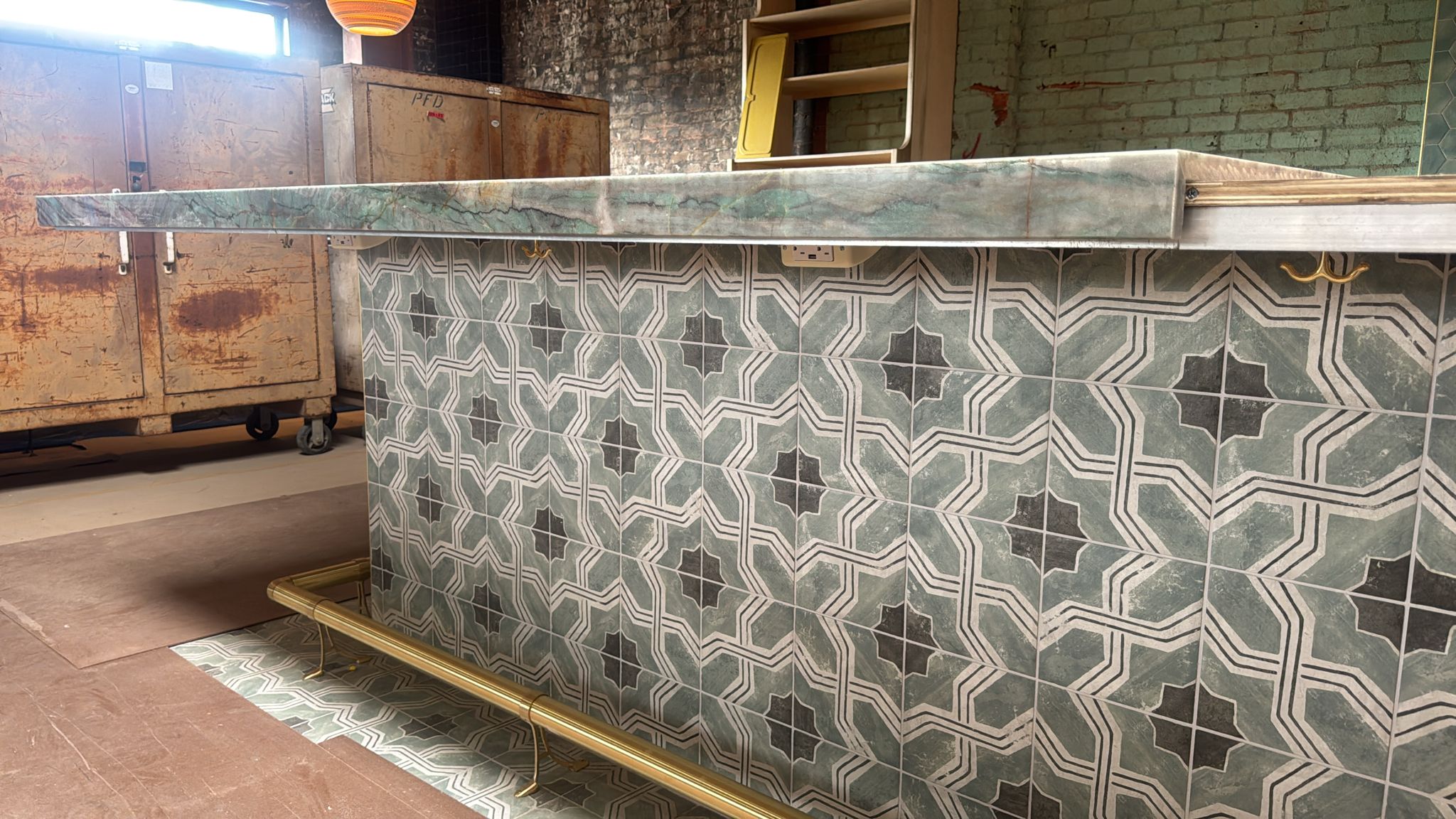 Custom quartzite bar with Moroccan-pattern tile base, Maydan Market Los Angeles